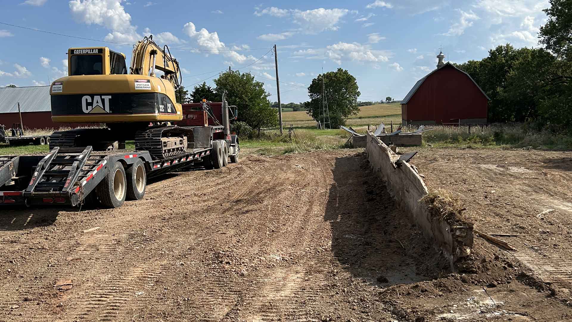 pb-land-management-kansas-excavation-tree-clearing-snow-removal-dam-digging-rock-hauling-land-clearing-demolition-retaining-walls-image-1920×1080-019-1.jpg Landowner inspecting a freshly mulched path along property edge.